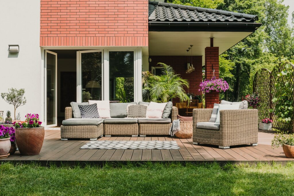 Elegant garden furniture on terrace of suburban home