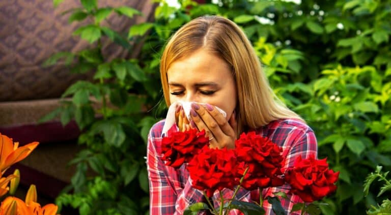 Girl's allergy to flowers. Selective focus