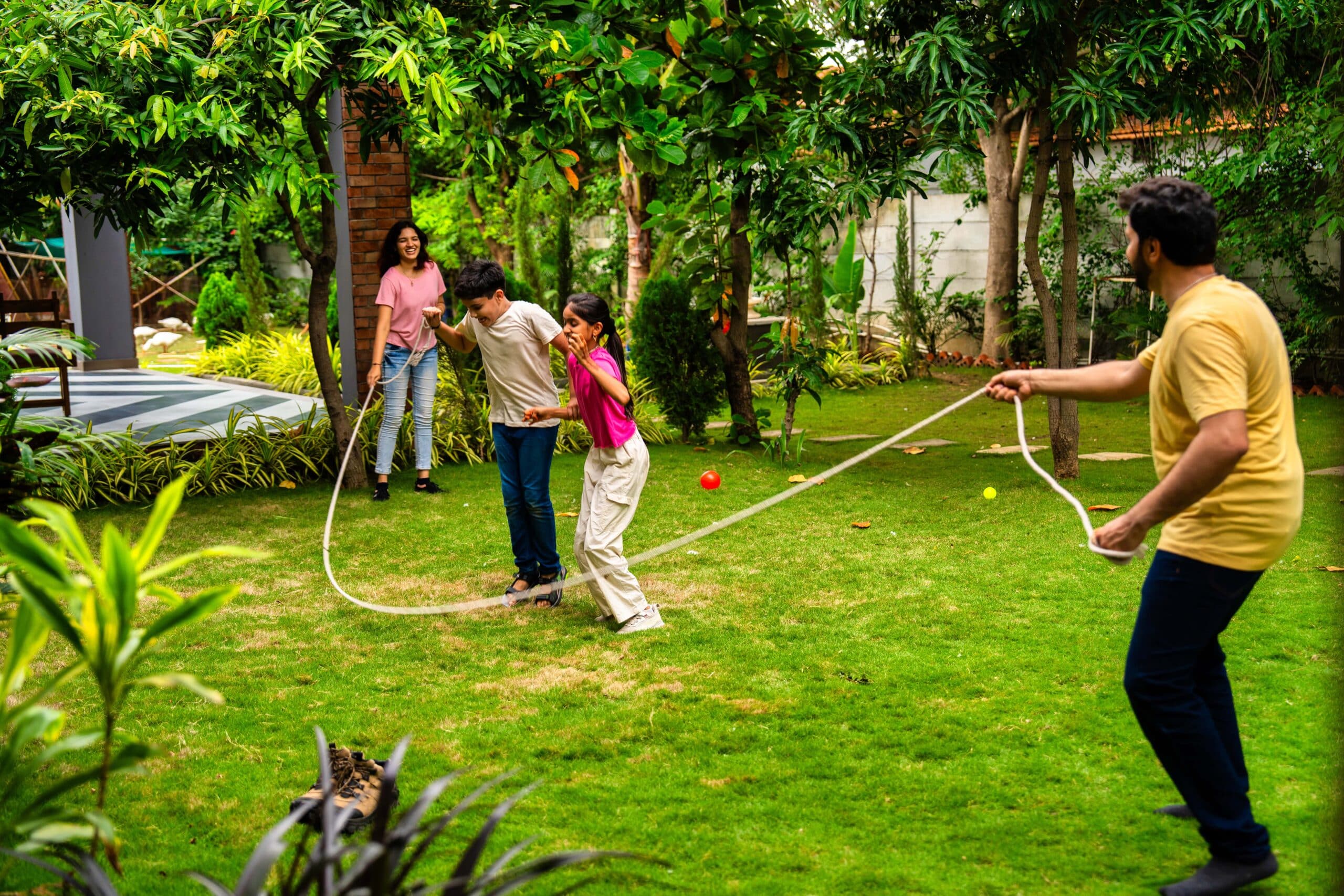 Close view of low-profile misting nozzles mounted beneath a wooden pergola handrail in a Trusville, AL outdoor living space